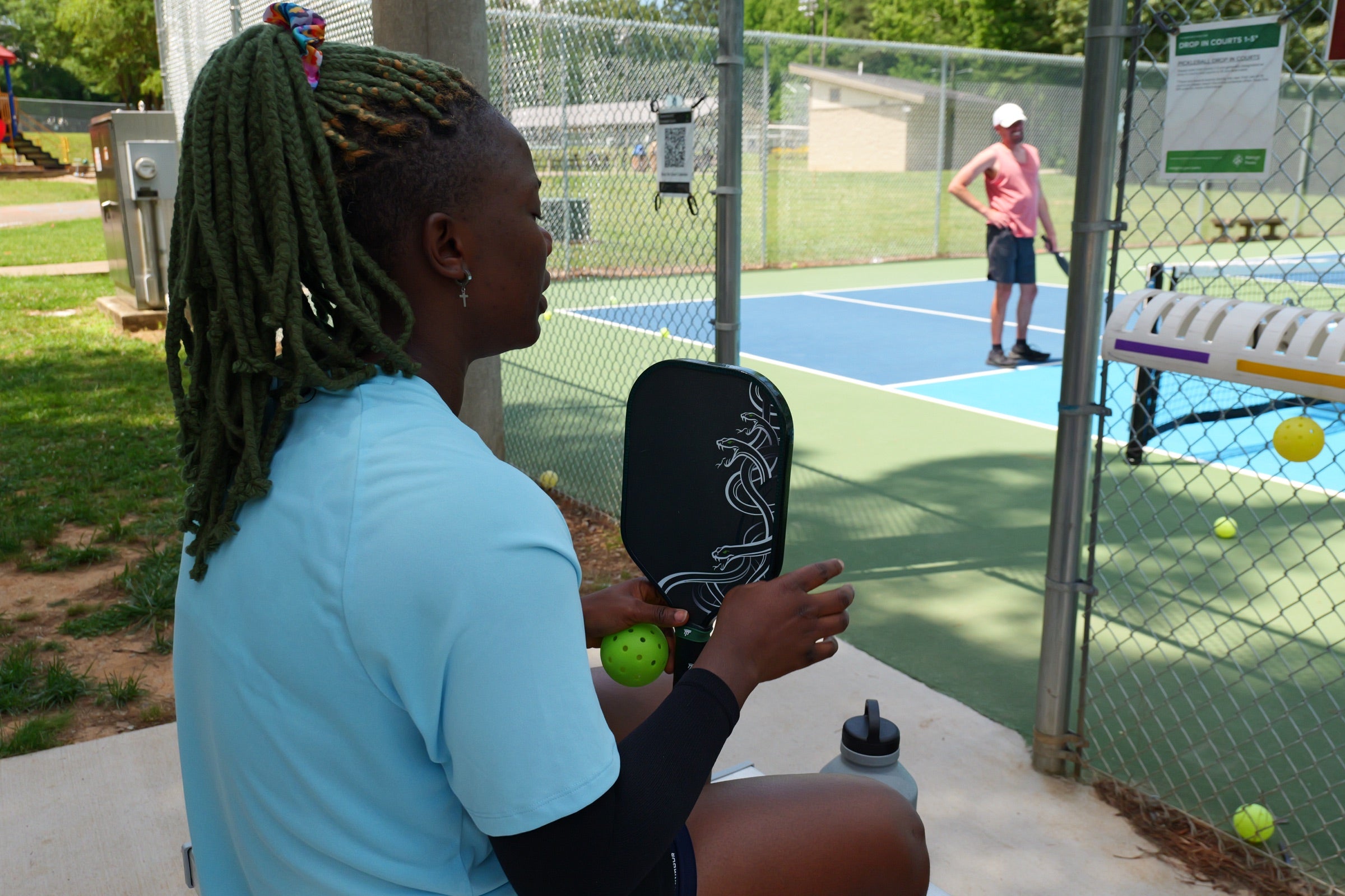 Filipino pickleball players courtside with the Medusa